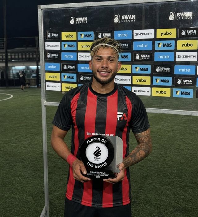A Football Amigos player holding the SWAN League Player of the Match award